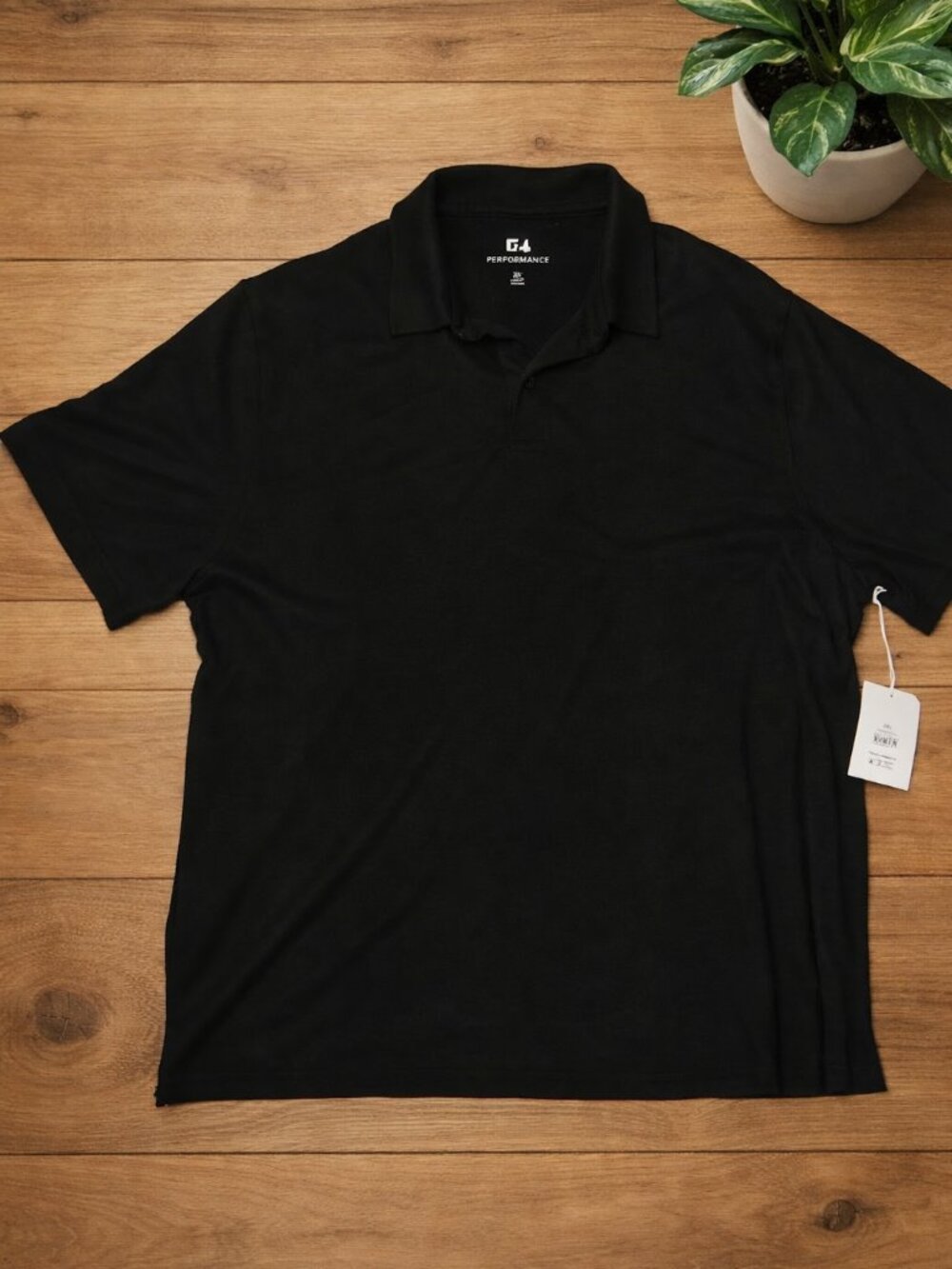 Classic, clean, and effortlessly versatile This black polo shir